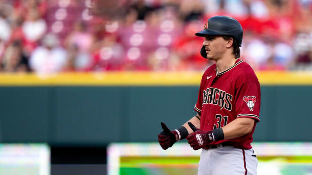 Jake McCarthy (31) gives his teammates the thumbs up after hitting a double against the Cincinnati Reds.